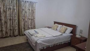 A bed or beds in a room at Marena Hurghada