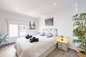 Ένα ή περισσότερα κρεβάτια σε δωμάτιο στο AlmeriaSuite Serenity Home