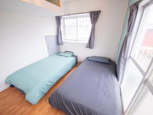 Postel nebo postele na pokoji v ubytování 富津屋 Futtsuya