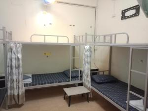 Postel nebo postele na pokoji v ubytování มังกรเลโฮสเทล Mangkonlay Hostel