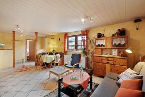 a living room with a couch and a table at Ferienwohnung Heike Schreiber in Sasbachwalden