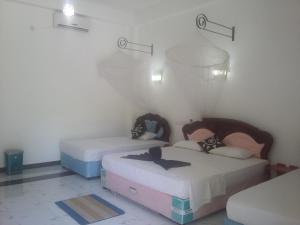 Postel nebo postele na pokoji v ubytování Peacock Reach Hotel