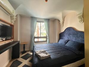 Et tv og/eller underholdning på Espana Jomtien Pattaya By Thita