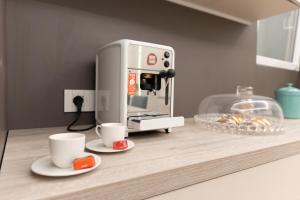 Příslušenství pro přípravu čaje a kávy v ubytování Quattro Canti Deluxe