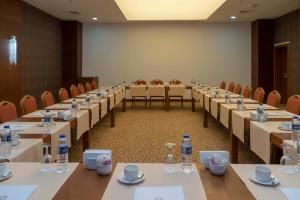 a conference room with long tables and chairs at Adalya Ocean Deluxe - Ultra All Inclusive in Side +88 photos