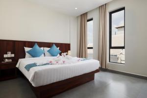Postel nebo postele na pokoji v ubytování Angkor Channary Hotel