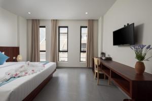 Postel nebo postele na pokoji v ubytování Angkor Channary Hotel + 37 fotografií