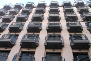 a tall building with balconies on the side of it at Piso SolyMar TRIMAR in Lloret de Mar