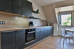 Kuchyň nebo kuchyňský kout v ubytování Guy 22 - A Sables d'Or les pins proche plage