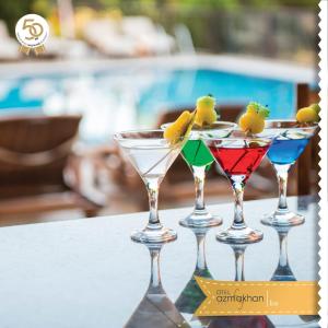 a group of four martini glasses sitting on a table at Hotel Azmakhan in Akyaka