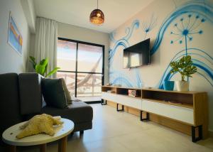 Et tv og/eller underholdning på Apto Ibiza Praia & Piscina - Conforto e Estilo