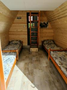 Postel nebo postele na pokoji v ubytování Rafting kamp Ivona