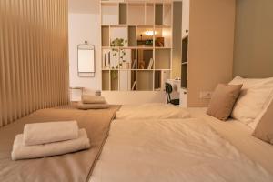 Posteľ alebo postele v izbe v ubytovaní P23 Apartments