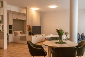 Televízia a/alebo spoločenská miestnosť v ubytovaní P23 Apartments
