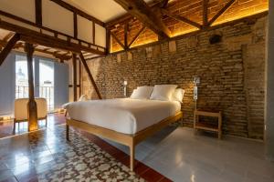 Postel nebo postele na pokoji v ubytování Hotel Carlos V