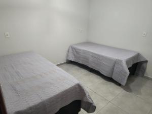 Postel nebo postele na pokoji v ubytování Apartamento Sonho Vivo + 3 fotografie