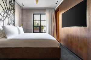 Ένα ή περισσότερα κρεβάτια σε δωμάτιο στο Ramban Hotel Jerusalem