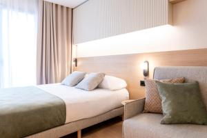 Posteľ alebo postele v izbe v ubytovaní Aparthotel Atenea Calabria