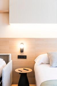 Posteľ alebo postele v izbe v ubytovaní Aparthotel Atenea Calabria