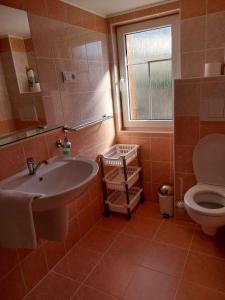 a bathroom with a sink and a toilet at Chata Bublava in Bublava