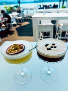 two cakes in wine glasses on a table at Ville Bianche in Drobollach am Faakersee