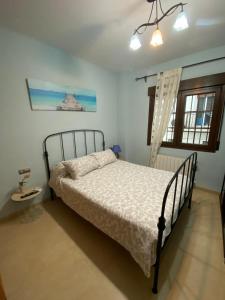 Ένα ή περισσότερα κρεβάτια σε δωμάτιο στο Le new village