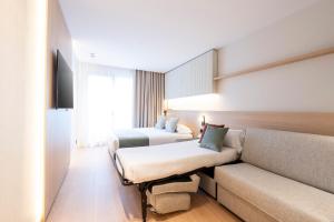 Posteľ alebo postele v izbe v ubytovaní Aparthotel Atenea Calabria