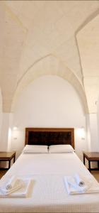 Ένα ή περισσότερα κρεβάτια σε δωμάτιο στο Villa Quaranta +56 φωτογραφίες