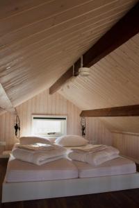 Postel nebo postele na pokoji v ubytování Sisters Beachbungalows