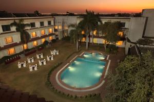 an overhead view of a swimming pool at a hotel at Hotel Express Residency-Jamnagar in Sika