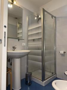 a bathroom with a sink and a shower at Napoleone Suite in Rome