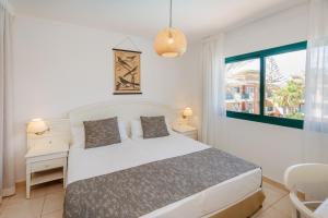 Postel nebo postele na pokoji v ubytování O7 Aloe Corralejo + 37 fotografií