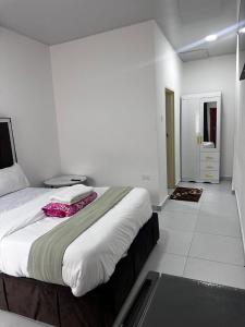 a bedroom with a large bed in a room at Verdi Lodge in Lusaka +13 photos
