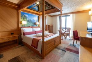 Postel nebo postele na pokoji v ubytování Hotel Intermonti