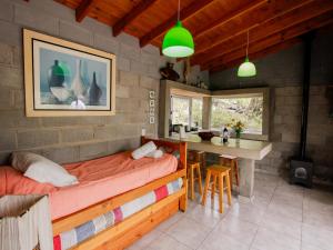 a room with a bench and a table in it at Alma Tierra in Merlo