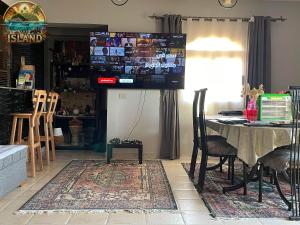 a dining room with a table and a table and chairs at The Island in Sharm El Sheikh +17 photos