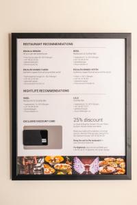 a picture of a menu on a wall at DINBNB Apartment l Skansen funhouse - 400m to Bryggen Gym & Parking in Bergen
