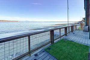 a balcony with a view of the water at Captain’s Quarters in Clinton