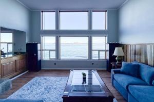 a living room with a couch and a table at Captain’s Quarters in Clinton