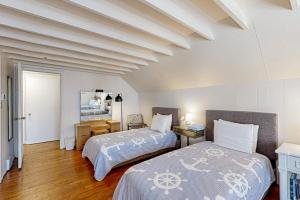 a bedroom with two beds and a room with at Ann Acres --- 21069 Elizabeth Ave. in Rehoboth Beach