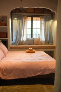 a bed with two teddy bears on top of it at Duka Mang Den in Kon Plong