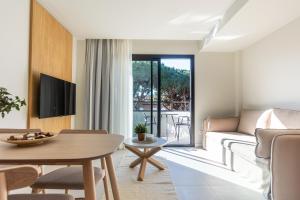 TV a/nebo společenská místnost v ubytování Fels Apartments