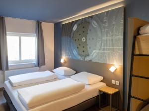 Postel nebo postele na pokoji v ubytování B&B HOTEL Fulda-Hbf