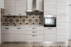 Kuchyň nebo kuchyňský kout v ubytování Famiglia 60MQ Giallo Milano Mxp Laghi