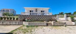 a house with a garden in front of it at House Karmela in Sućuraj +21 photos