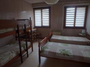 Postel nebo postele na pokoji v ubytování Les Logettes appartements dans ancienne ferme rénovée
