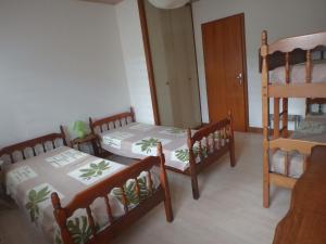 Postel nebo postele na pokoji v ubytování Les Logettes appartements dans ancienne ferme rénovée