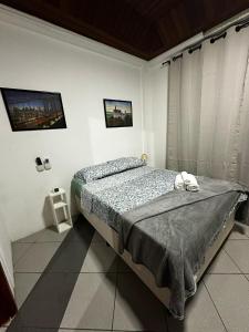 Ένα ή περισσότερα κρεβάτια σε δωμάτιο στο First Floor Umarizal House COP30