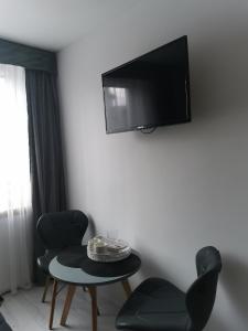 Televízia a/alebo spoločenská miestnosť v ubytovaní Villa Basia