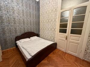 Postel nebo postele na pokoji v ubytování KM Hostel and Tourism